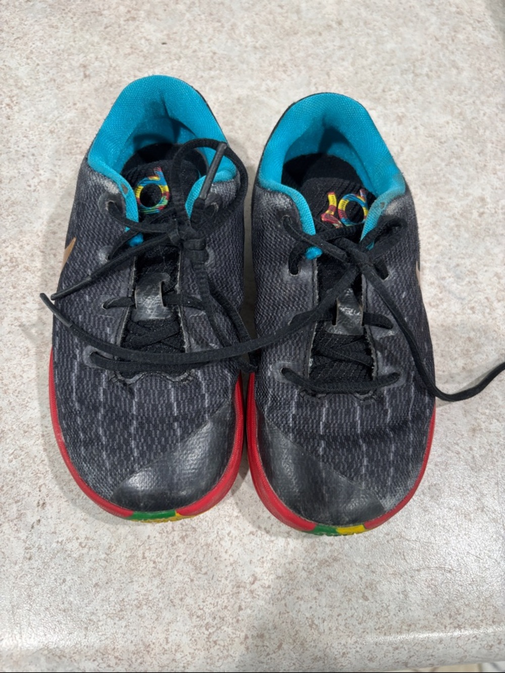 Nike Kids Sneakers in Black with Teal Lining and Red Sole